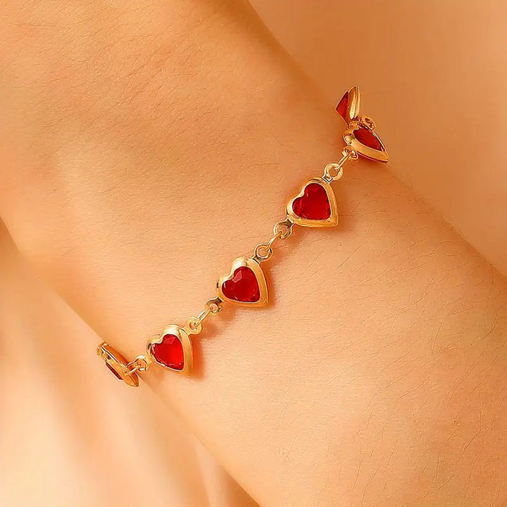Bracciale cuore in rubino dorato