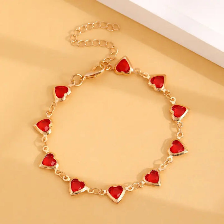 Bracciale cuore in rubino dorato