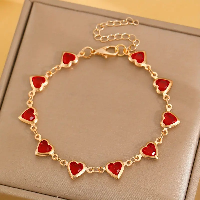 Bracciale cuore in rubino dorato