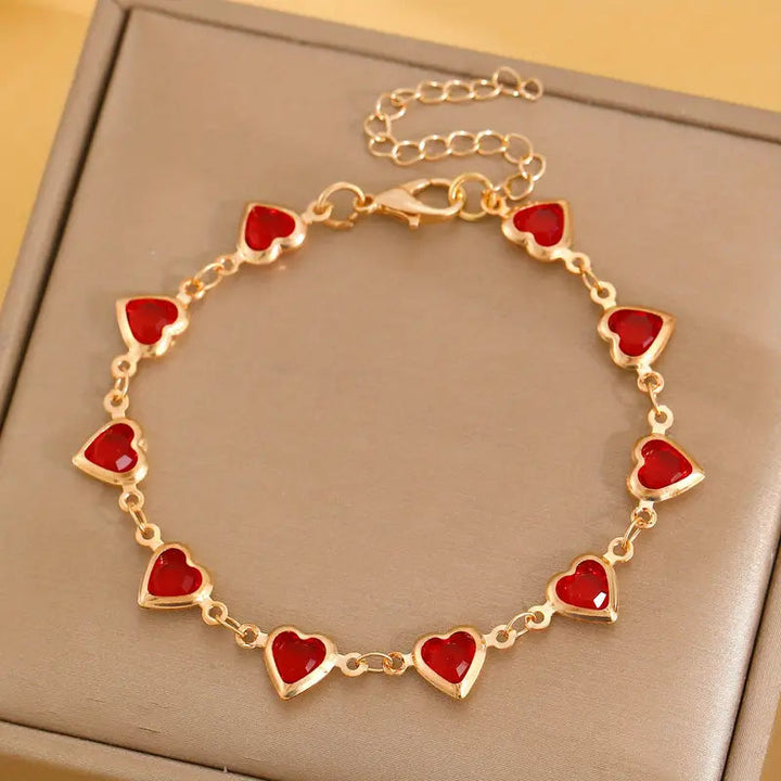 Bracciale cuore in rubino dorato