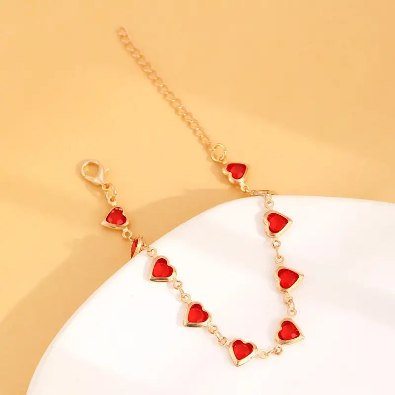 Bracciale cuore in rubino dorato