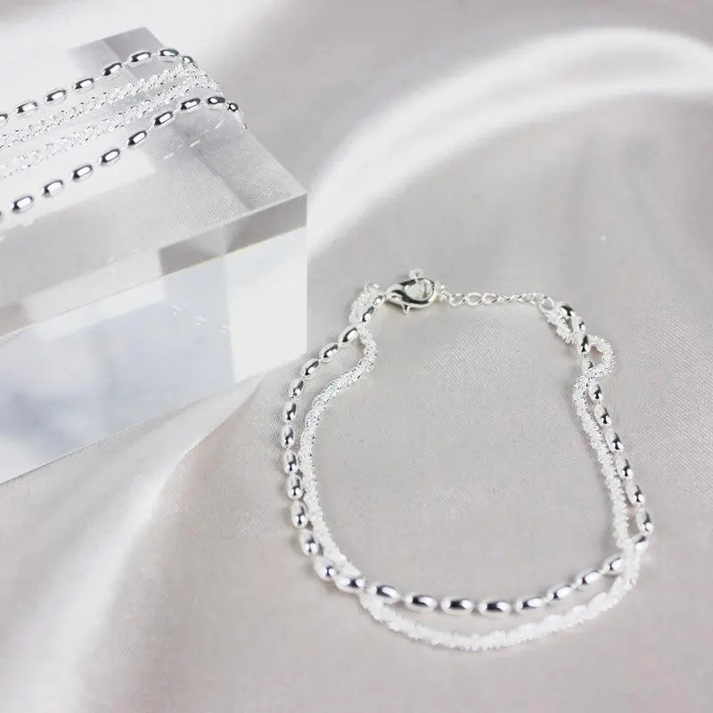 Set di bracciali eleganti in argento con zirconi