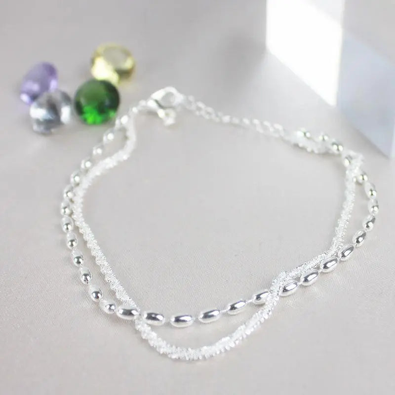 Set di bracciali eleganti in argento con zirconi