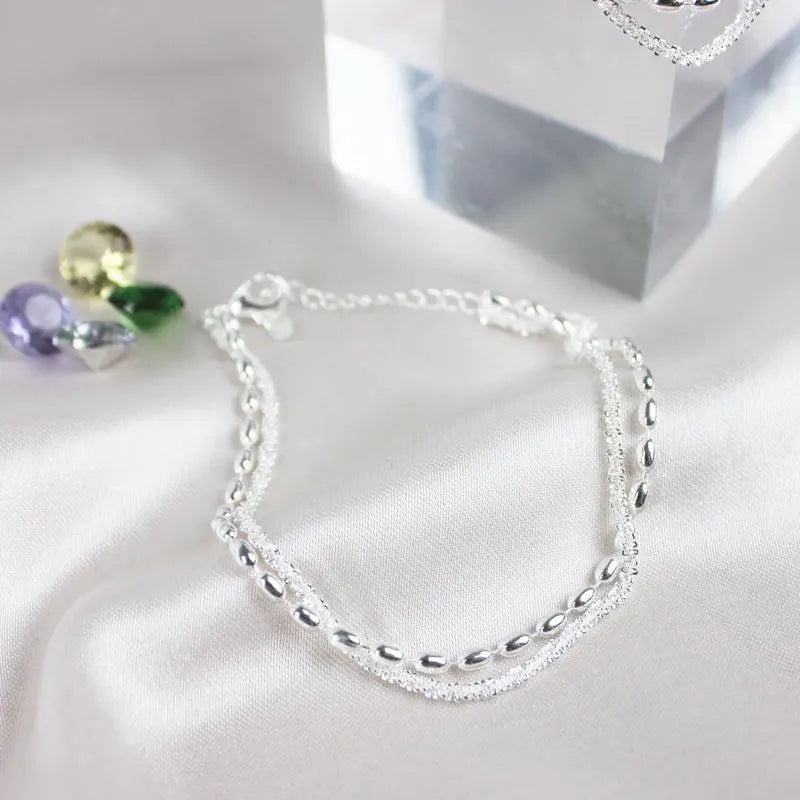 Set di bracciali eleganti in argento con zirconi