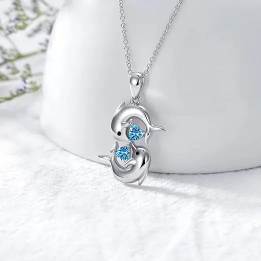 Collana in Argento con Doppio Delfino e Cristallo Blu