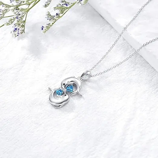 Collana in Argento con Doppio Delfino e Cristallo Blu
